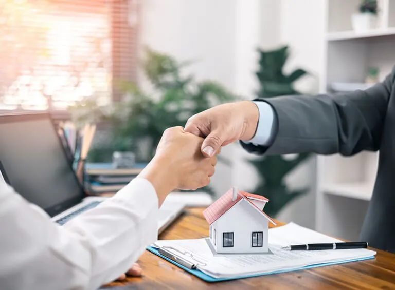 Home loan consultation with a house model